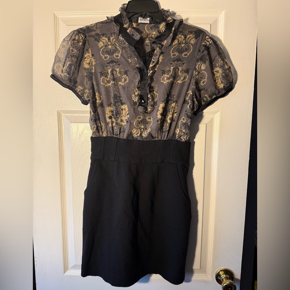 Elegant Bebe Black and Gold Floral Dress with fitted black skirt bottom